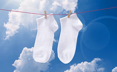 White socks drying on a line
