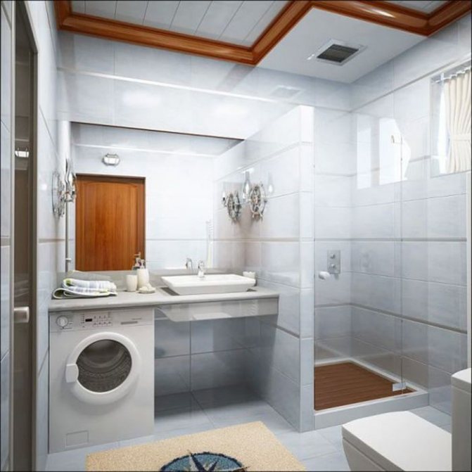 Shower stall in bathroom with washing machine