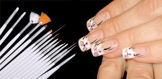 Manicure brushes and painted nails