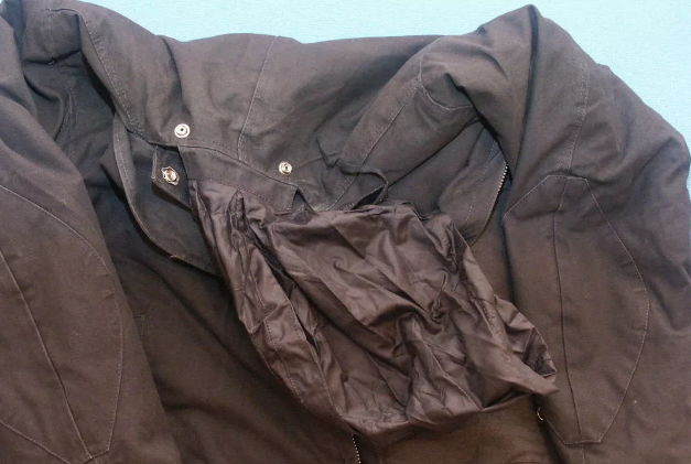 Jacket with oil stains