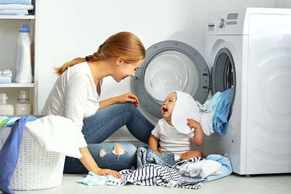 Mom and baby sort things out after washing