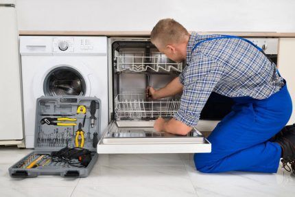 Master repairing a dishwasher