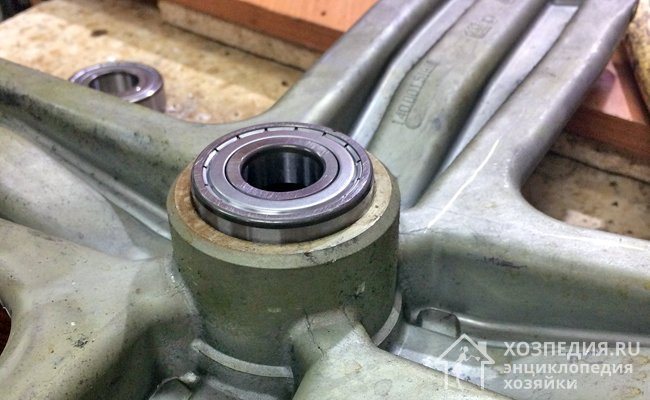 New bearing, partially seated in the seat