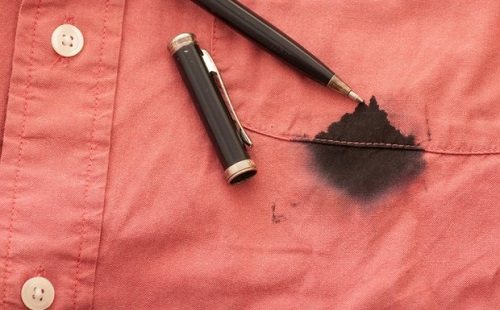 a stain of ink from a ballpoint pen on a red shirt pocket