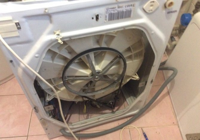 remove the back wall of the washer housing
