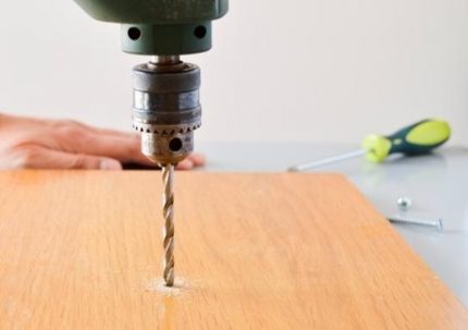 Drilling a panel with a drill
