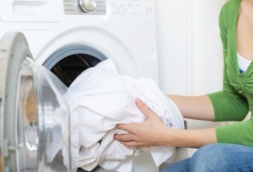 Loading laundry into the washing machine
