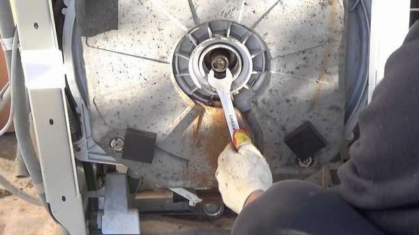 Replacing bearings in a top-loading washing machine